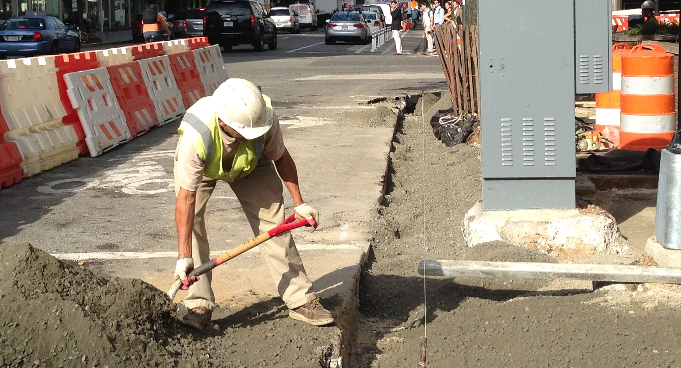 construction worker shovels dirt