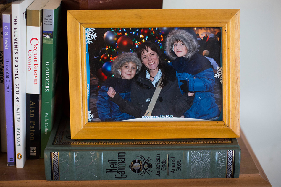 framed picture of mother and her two boys bundled in their winter coats